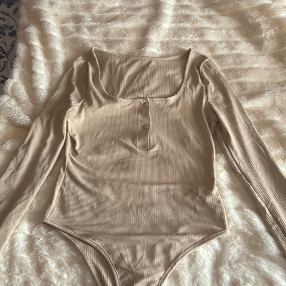 Cream colored bodysuit